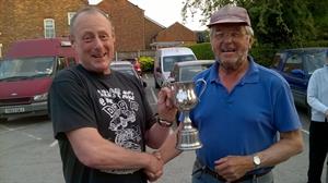 Paul (left) receives the first prize from our Chairman, John.