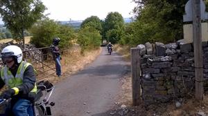 Jim looks like he's enjoying himself as Barrie prepares to negotiate the gated road.