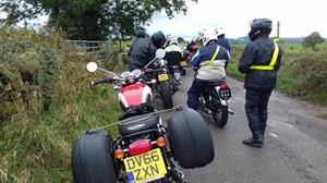 An impromptu comfort break brought us all to a halt. The photo also shows Clive's ingenious method of holding the panniers onto his modern Bonneville! The roads had dried a little by this time.