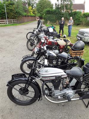 A row of British singles (not including the riders,)