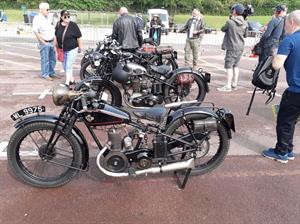 Henry Cole talks to camera.  Our Lads' bikes in the forefront